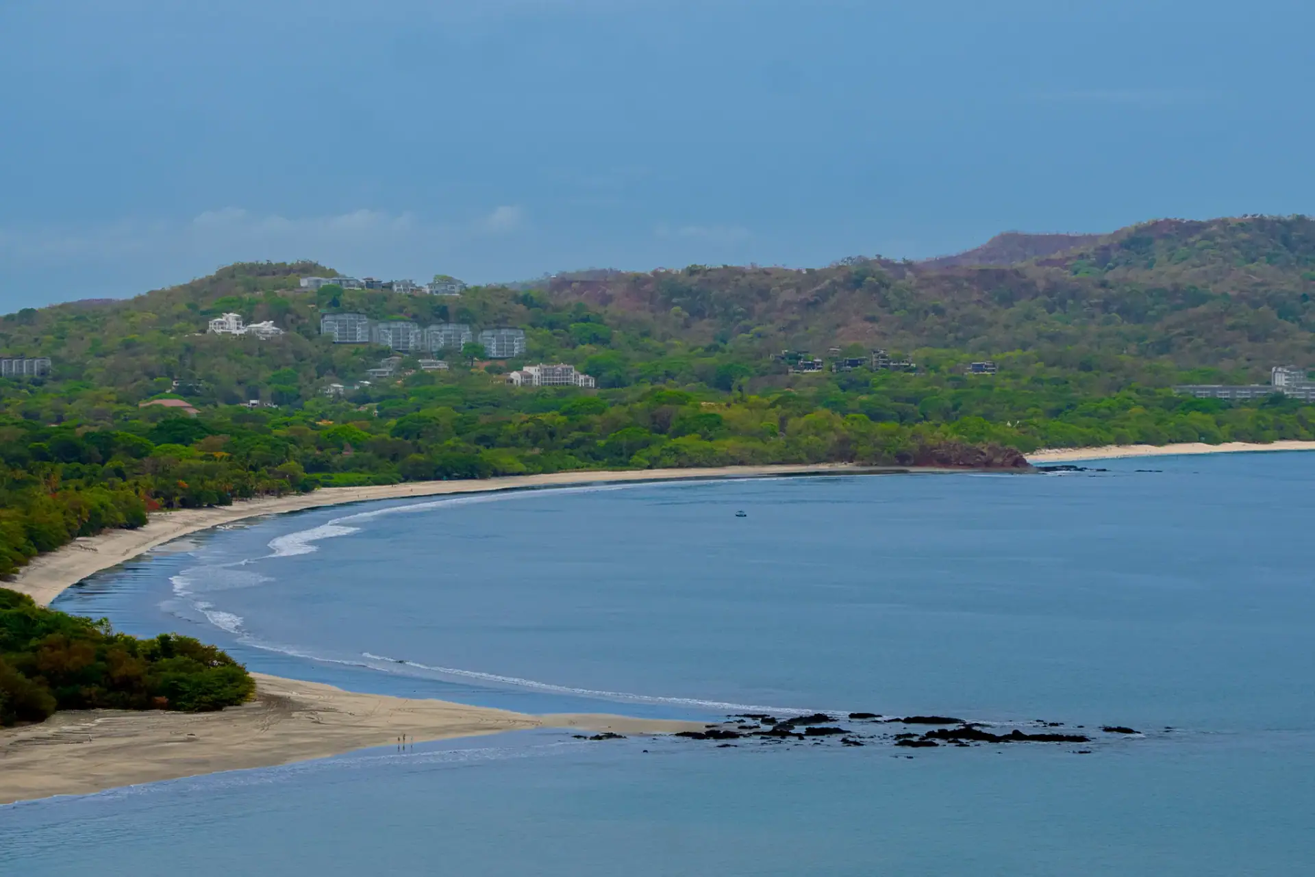 Brasilito bay curve with golden sand and green hills