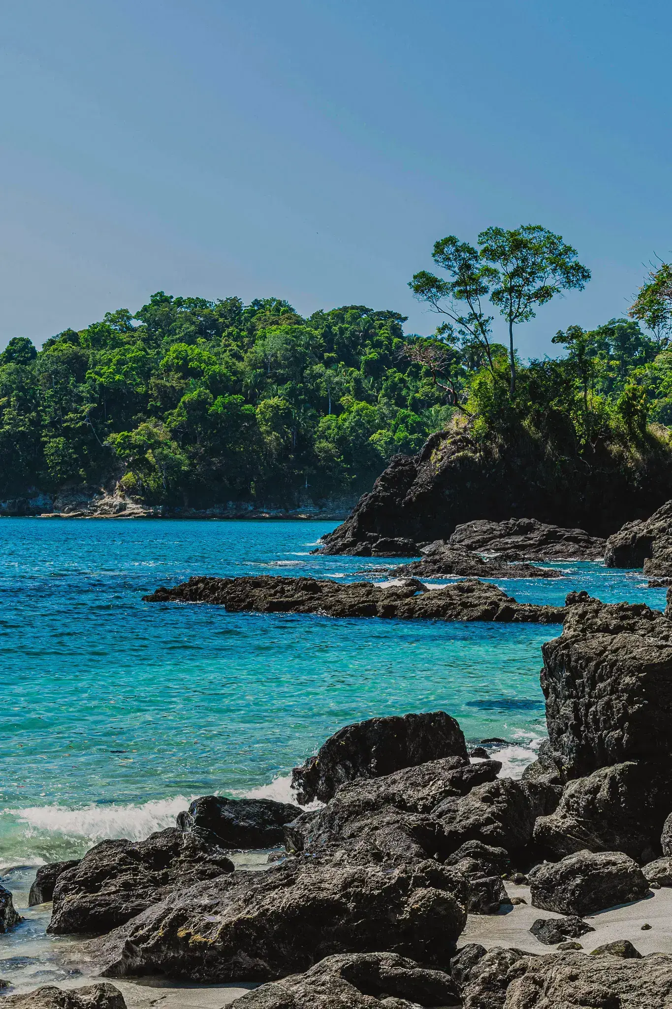 Turquoise water and rocky point at Playa Conchal
